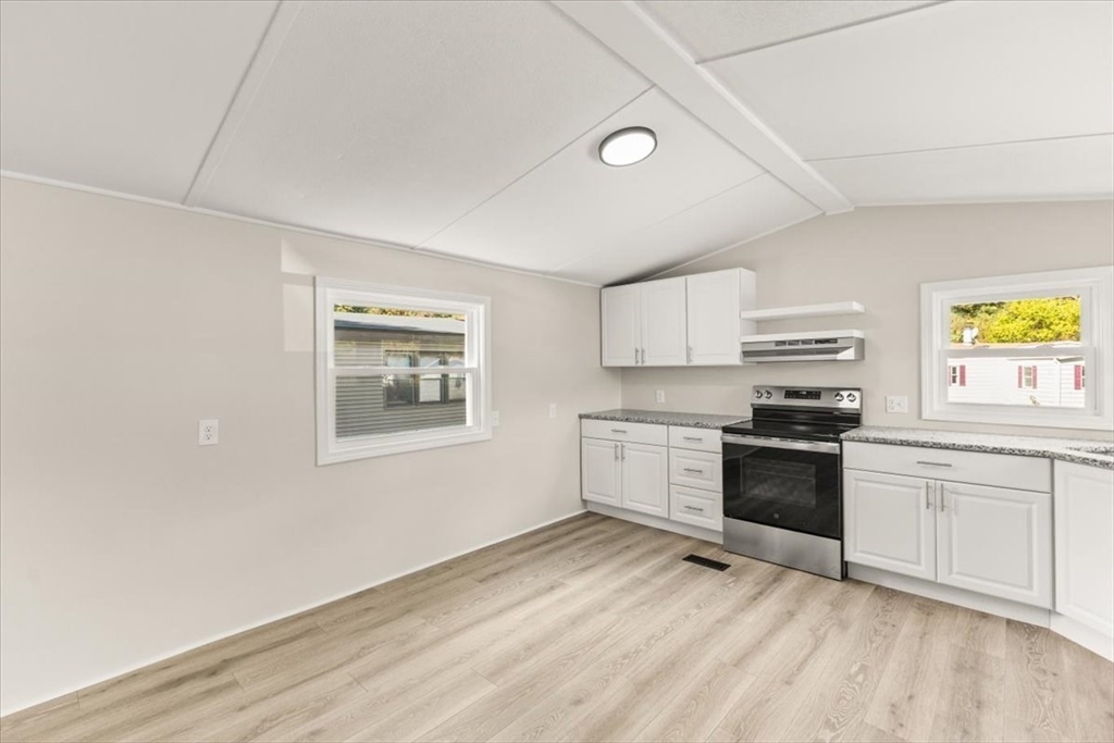 5 Marks Way Carver, MA 02330 - Photo 9 of 23 a kitchen with stainless steel appliances granite countertop a stove and a refrigerator