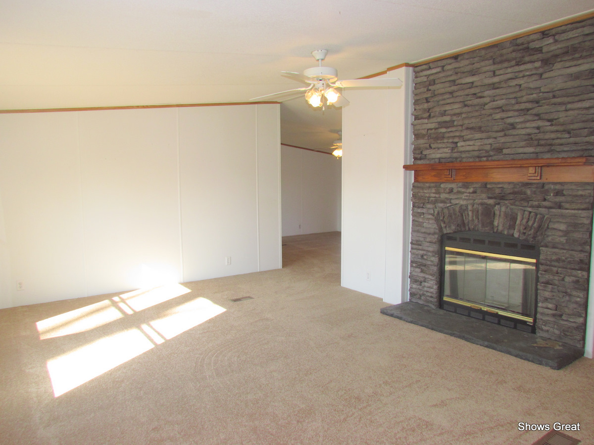 4714 Wade Road Roanoke, VA 24018 - Photo 2 of 16 a view of empty room with window and fireplace