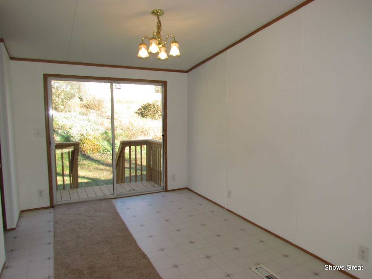 4714 Wade Road Roanoke, VA 24018 - Photo 11 of 16 a view of an empty room with a window