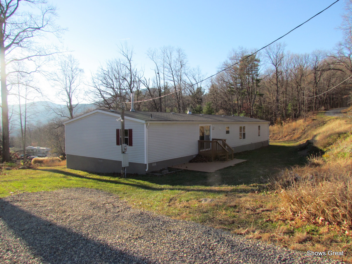 4714 Wade Road Roanoke, VA 24018 - Photo 16 of 16 a view of a house with a yard
