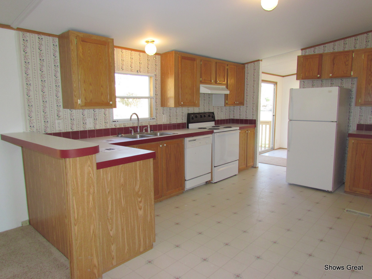4714 Wade Road Roanoke, VA 24018 - Photo 8 of 16 a kitchen with a sink stove and refrigerator