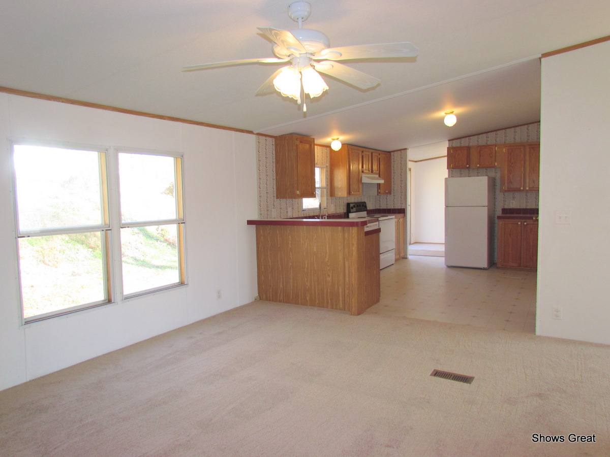 4714 Wade Road Roanoke, VA 24018 - Photo 10 of 16 a view of a kitchen with a sink and a window