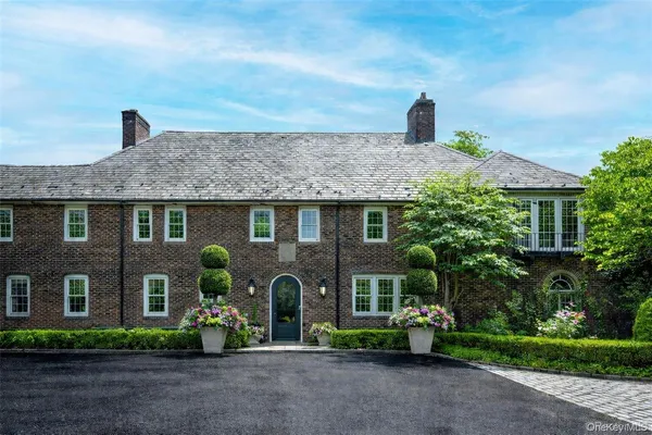 a front view of a house with garden