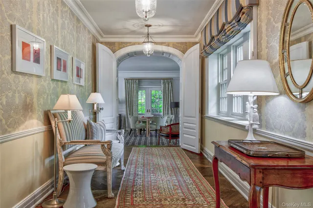 a dining room with furniture and wooden floor