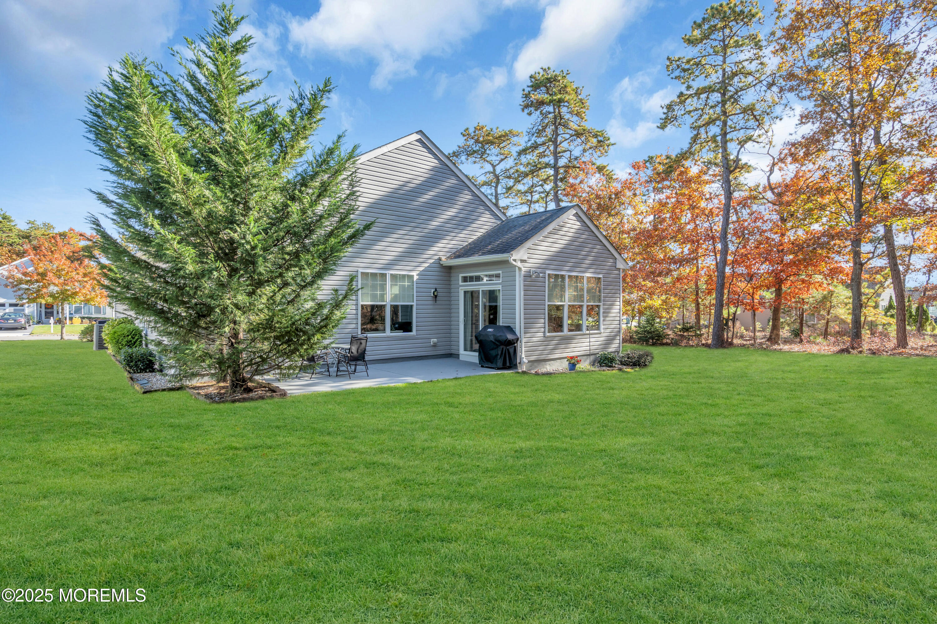 339 Newport Way Little Egg Harbor, NJ 08087 - Photo 17 of 32 a front view of a house with a garden