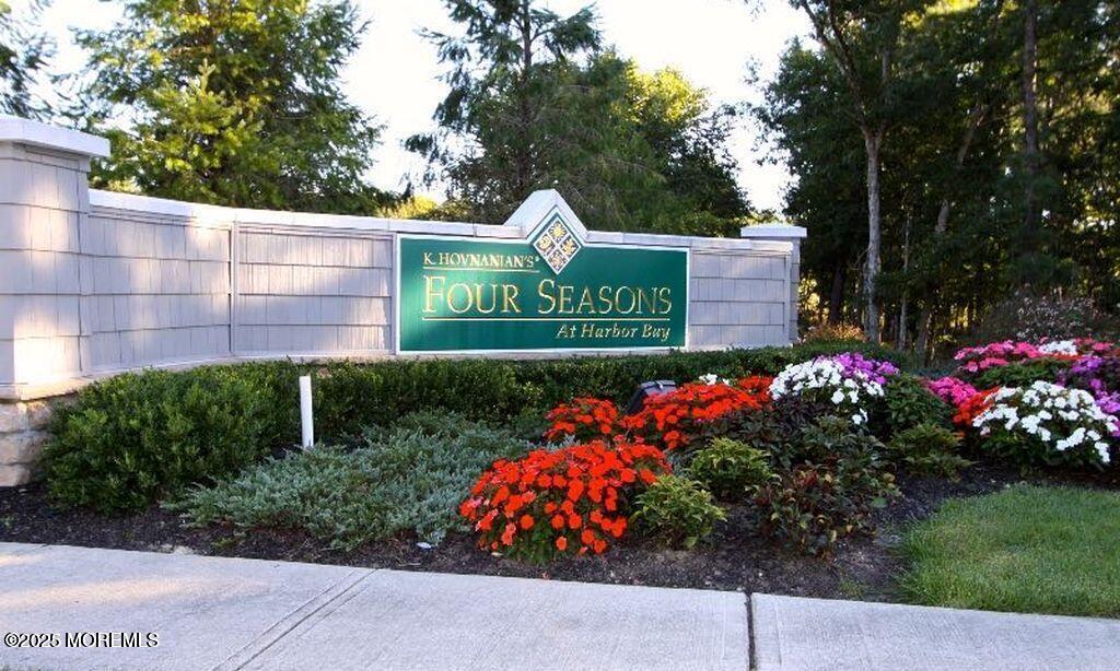 339 Newport Way Little Egg Harbor, NJ 08087 - Photo 18 of 32 a sign that is in front of flowers