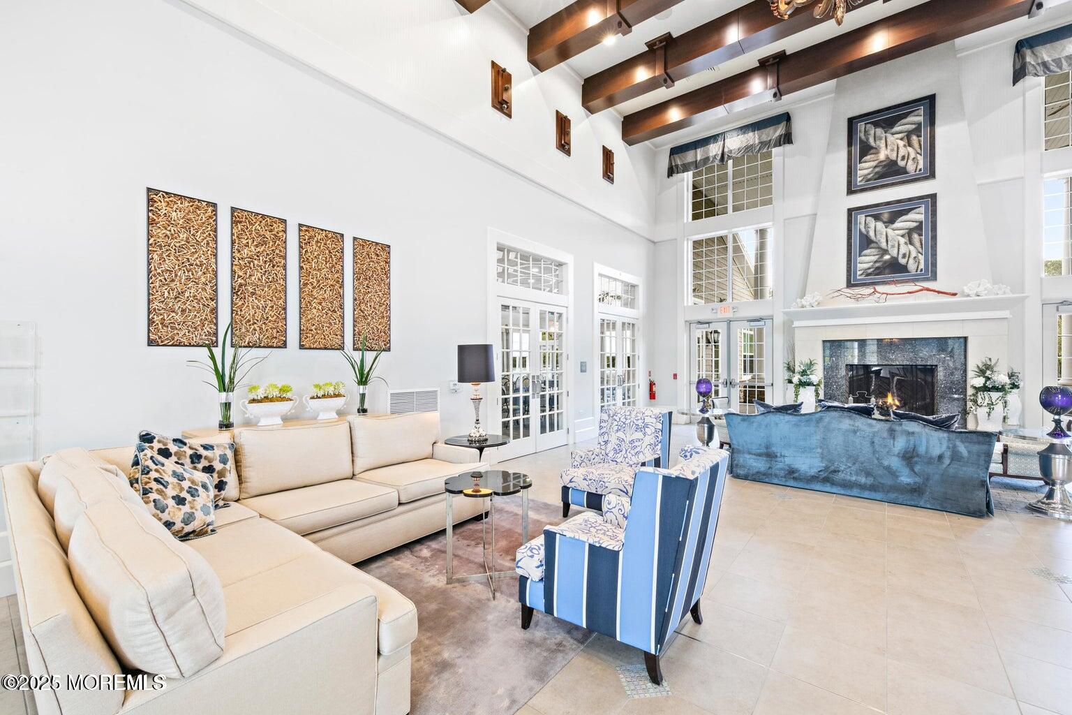 339 Newport Way Little Egg Harbor, NJ 08087 - Photo 21 of 32 a living room with furniture and a fireplace