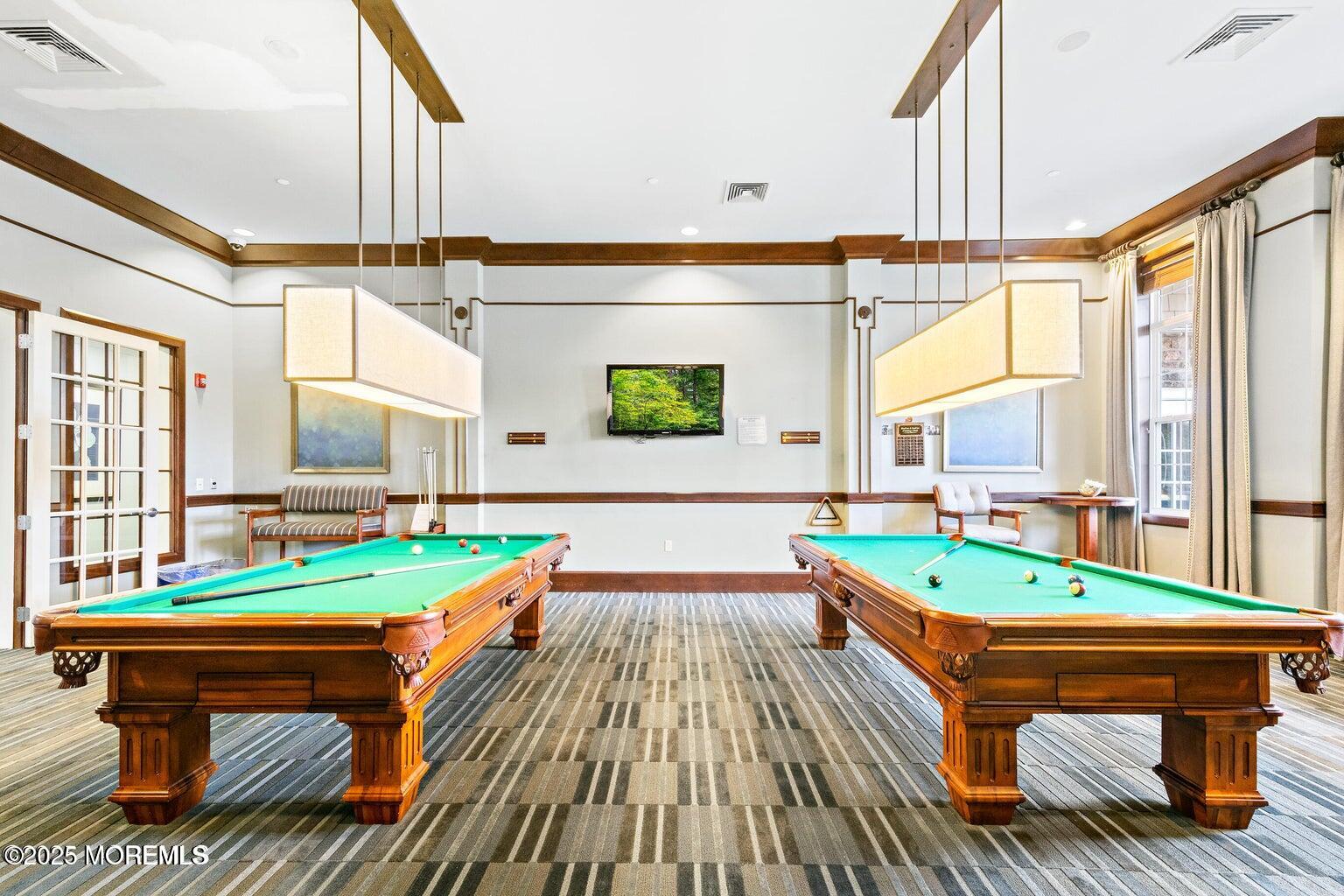 339 Newport Way Little Egg Harbor, NJ 08087 - Photo 22 of 32 a room with wooden floor pool table and chairs