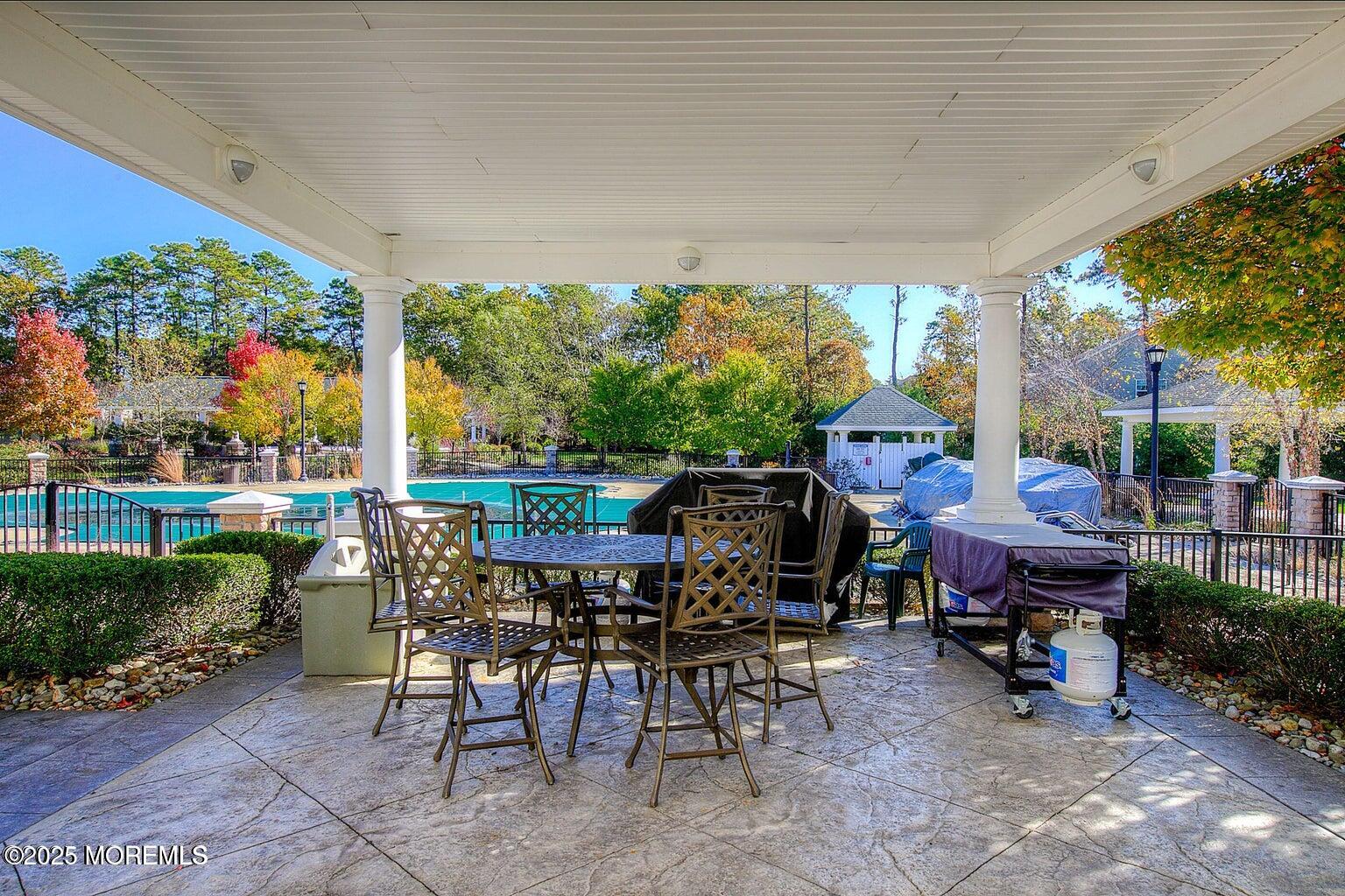 339 Newport Way Little Egg Harbor, NJ 08087 - Photo 25 of 32 a view of a tables and chairs in patio