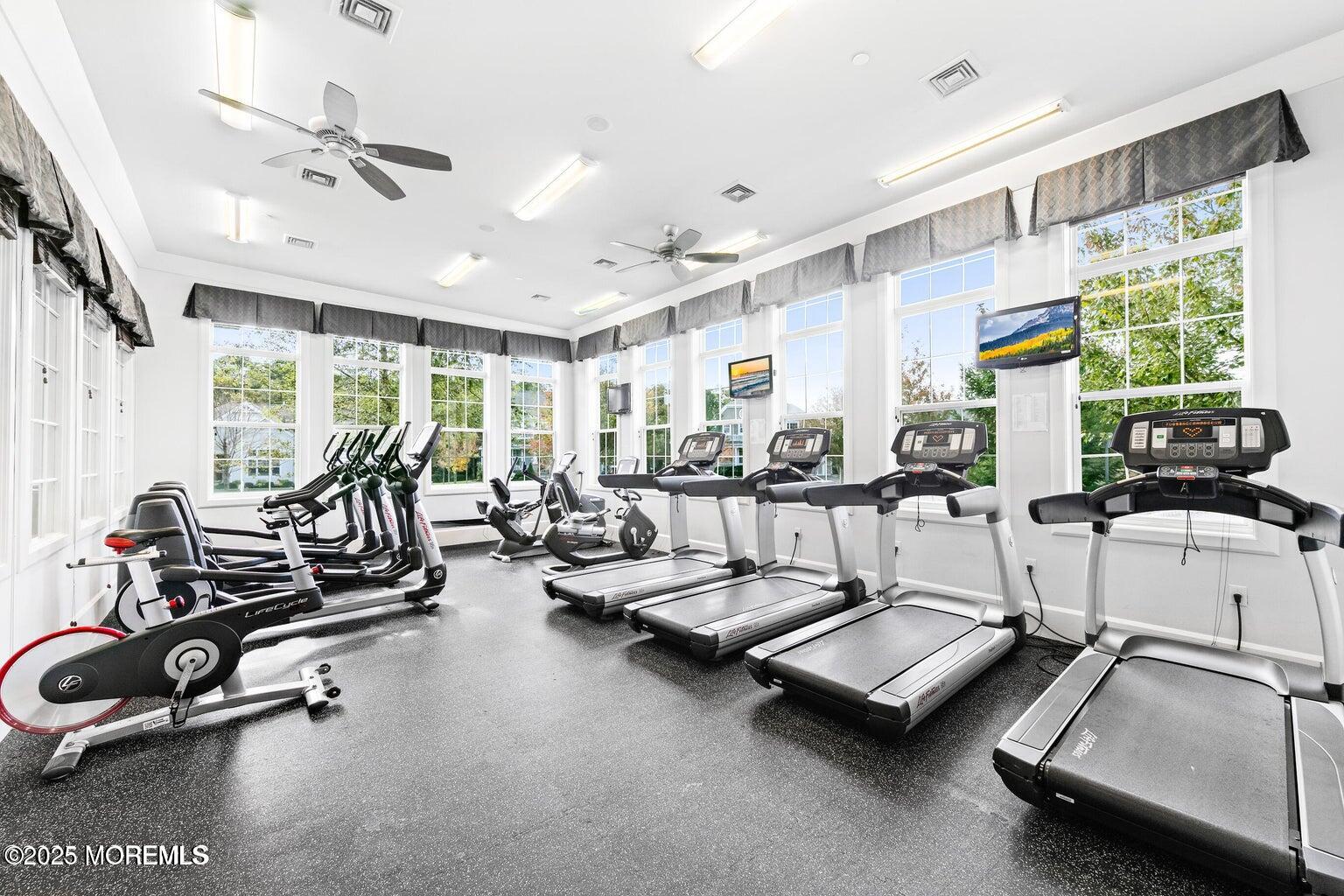 339 Newport Way Little Egg Harbor, NJ 08087 - Photo 26 of 32 a room with gym equipment and a large window