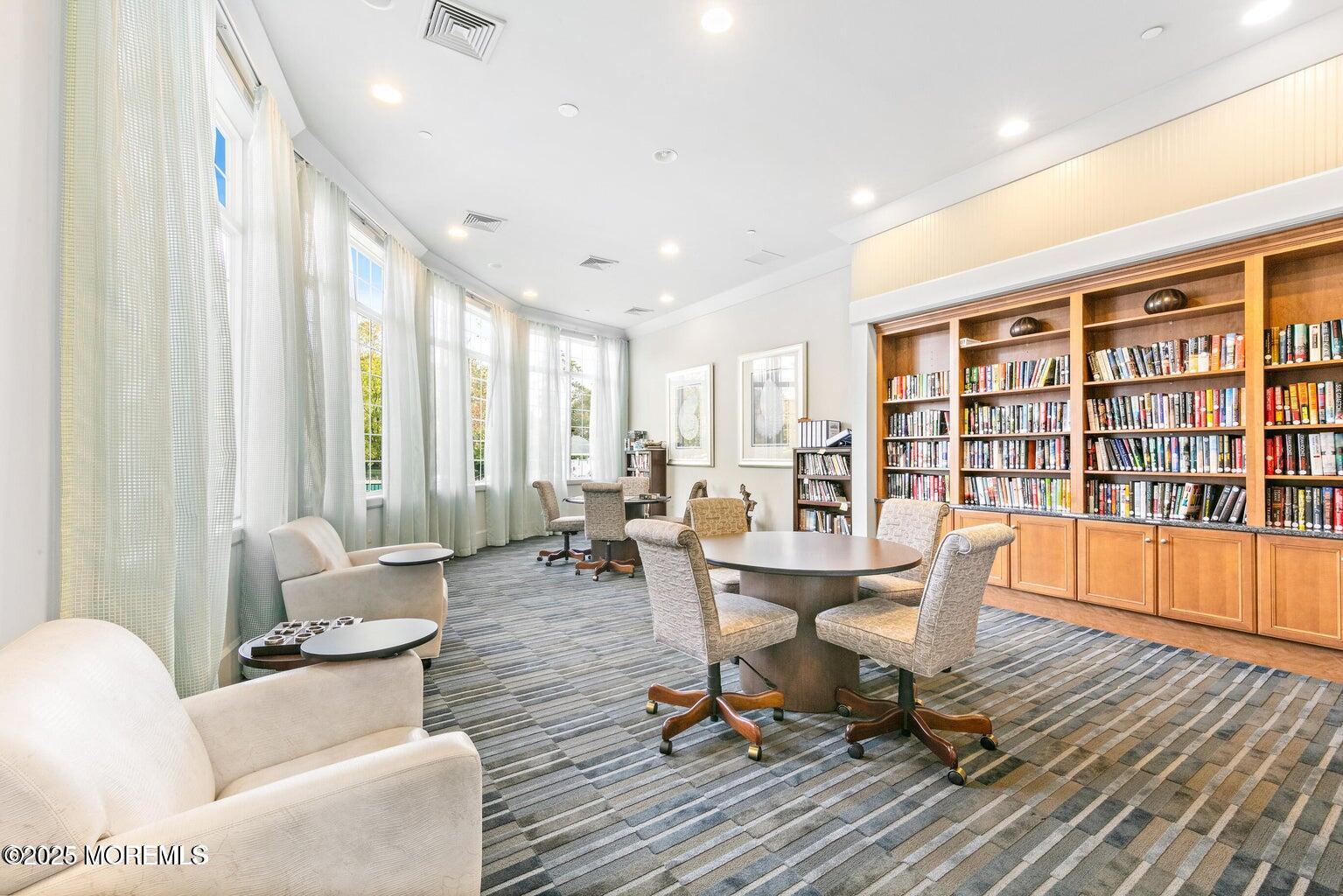 339 Newport Way Little Egg Harbor, NJ 08087 - Photo 28 of 32 a living room with furniture a rug and a large window
