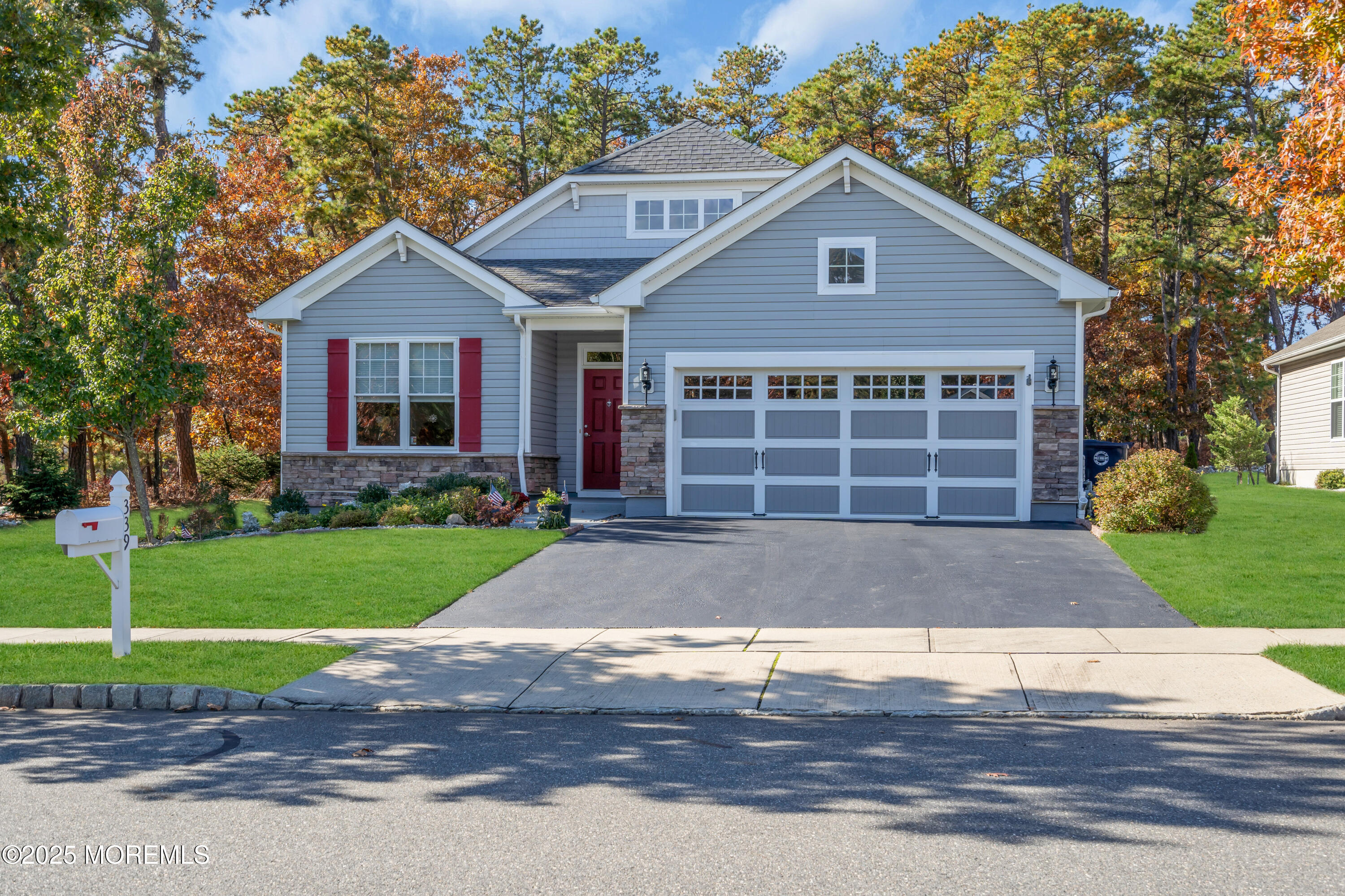 339 Newport Way Little Egg Harbor, NJ 08087 - Photo 3 of 32 a front view of a house with a yard and garage