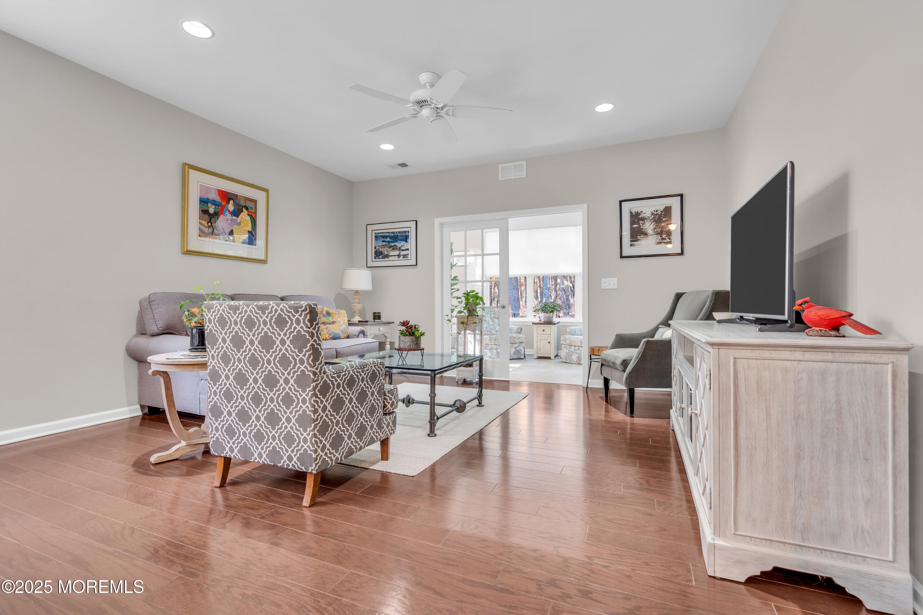 339 Newport Way Little Egg Harbor, NJ 08087 - Photo 9 of 32 a living room with furniture and a flat screen tv