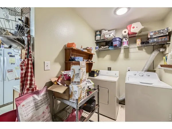 a living room with furniture a piano and a window