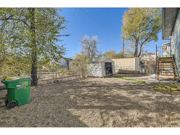 a backyard of a house with oven and garden
