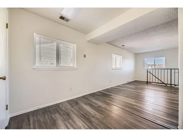 a workspace with furniture and clutter