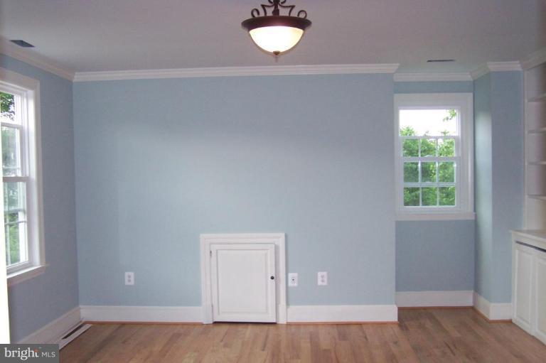 1039 Corbett Road Monkton, MD 21111 - Photo 15 of 22 an empty room with wooden floor and windows