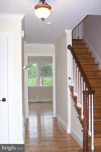 1039 Corbett Road Monkton, MD 21111 - Photo 17 of 22 a view of entryway and hall with wooden floor