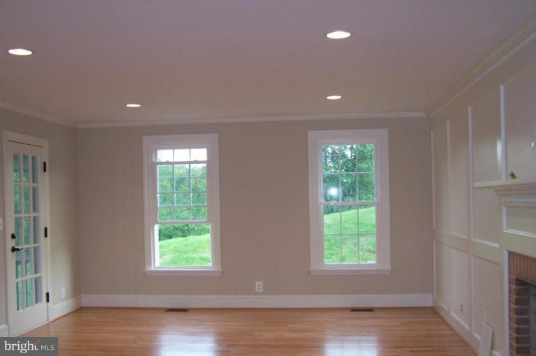 1039 Corbett Road Monkton, MD 21111 - Photo 19 of 22 a view of an empty room with wooden floor and a window