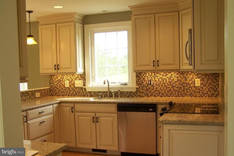 1039 Corbett Road Monkton, MD 21111 - Photo 6 of 22 a kitchen with a sink cabinets appliances and a window