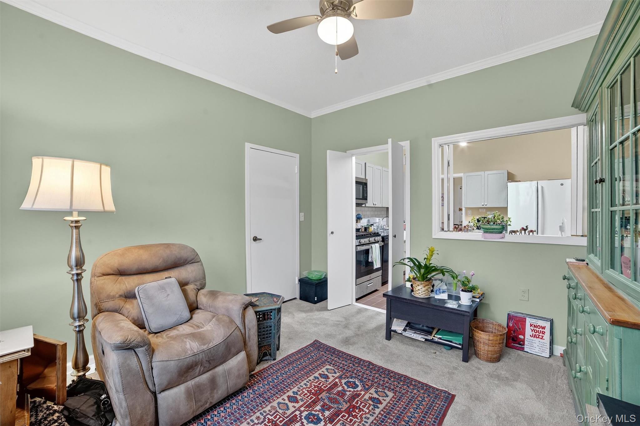 16 Rockledge Avenue, Unit 5L2 Ossining, NY 10562 - Photo 15 of 33 a living room with furniture and a potted plant