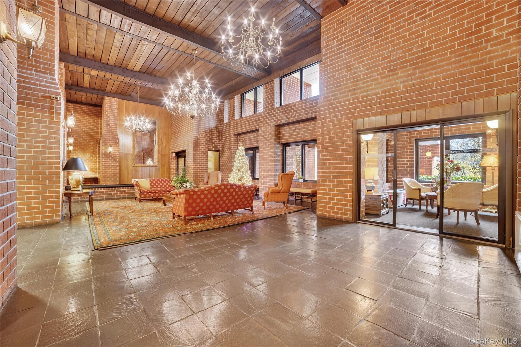 16 Rockledge Avenue, Unit 5L2 Ossining, NY 10562 - Photo 3 of 33 a living room with furniture and a chandelier