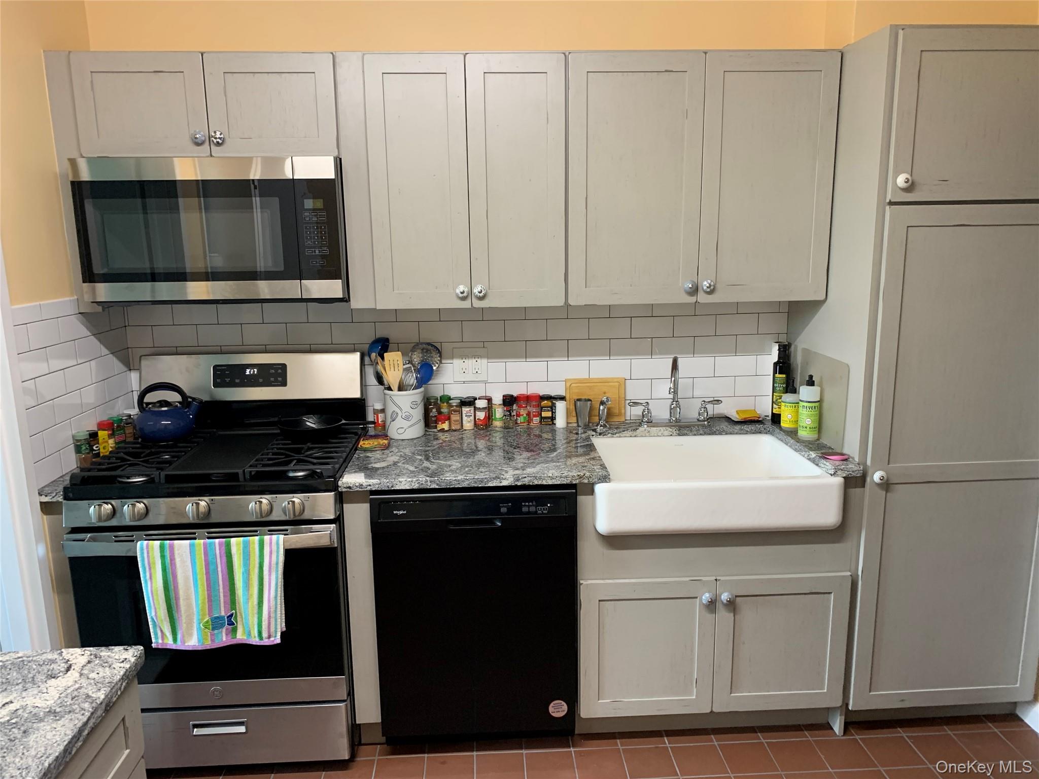 16 Rockledge Avenue, Unit 5L2 Ossining, NY 10562 - Photo 10 of 33 a kitchen with a sink and cabinets