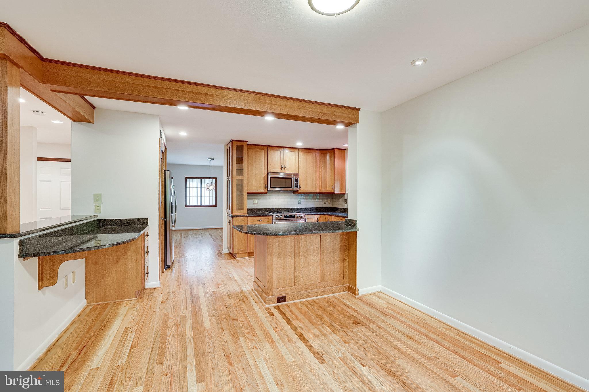 1575 Inlet Court Reston, VA 20190 - Photo 17 of 57 Beautiful Wood Floors in Kitchen, DR, Den & Foyer