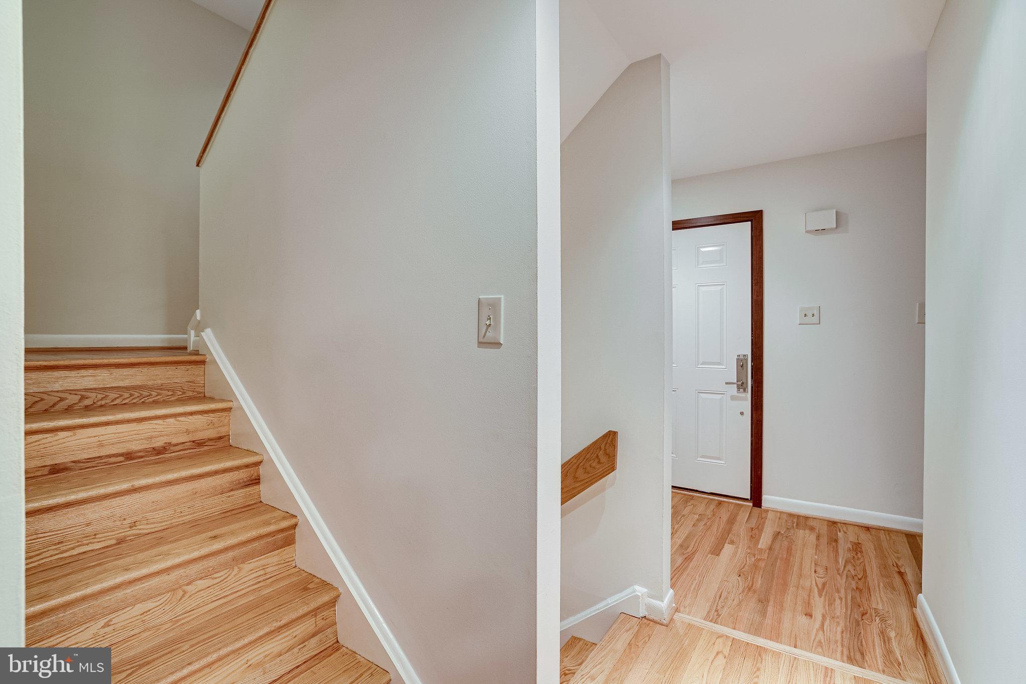 1575 Inlet Court Reston, VA 20190 - Photo 22 of 57 Stairwell & Front Door in Background