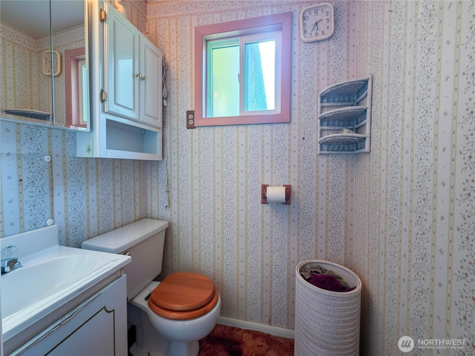 518 Bridge Street Twisp, WA 98856 - Photo 23 of 40 a bathroom with a toilet a sink and mirror