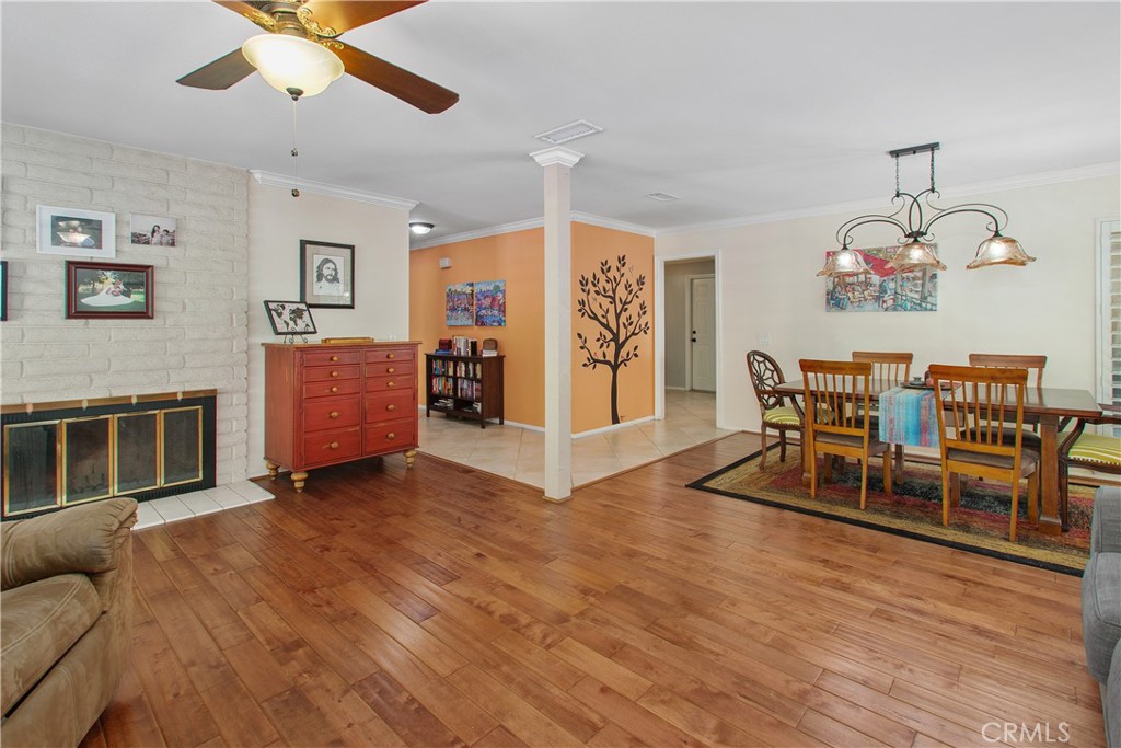 1451 Trenton Drive Riverside, CA 92506 - Photo 11 of 41 The living area is a lovely open space. The tile floor of the entry melds into luxury laminate flooring.
