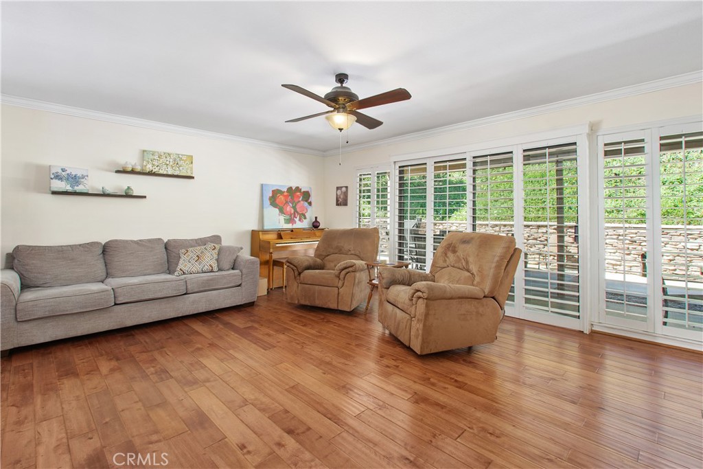 1451 Trenton Drive Riverside, CA 92506 - Photo 12 of 41 The large sliding door in the living room offers access to the back patio and also allows natural light into the space.
