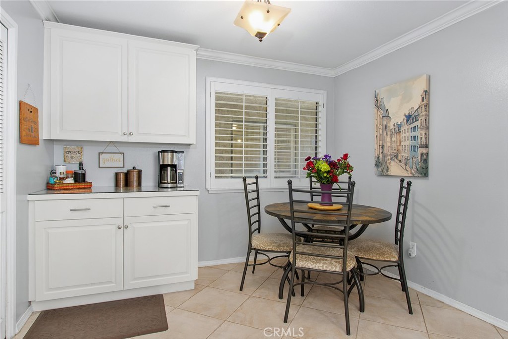 1451 Trenton Drive Riverside, CA 92506 - Photo 23 of 41 What a great nook to sit and enjoy breakfast. The window looks out on the front entry. You can see your guests arriving! The door to the attached garage is just to the right of the table.