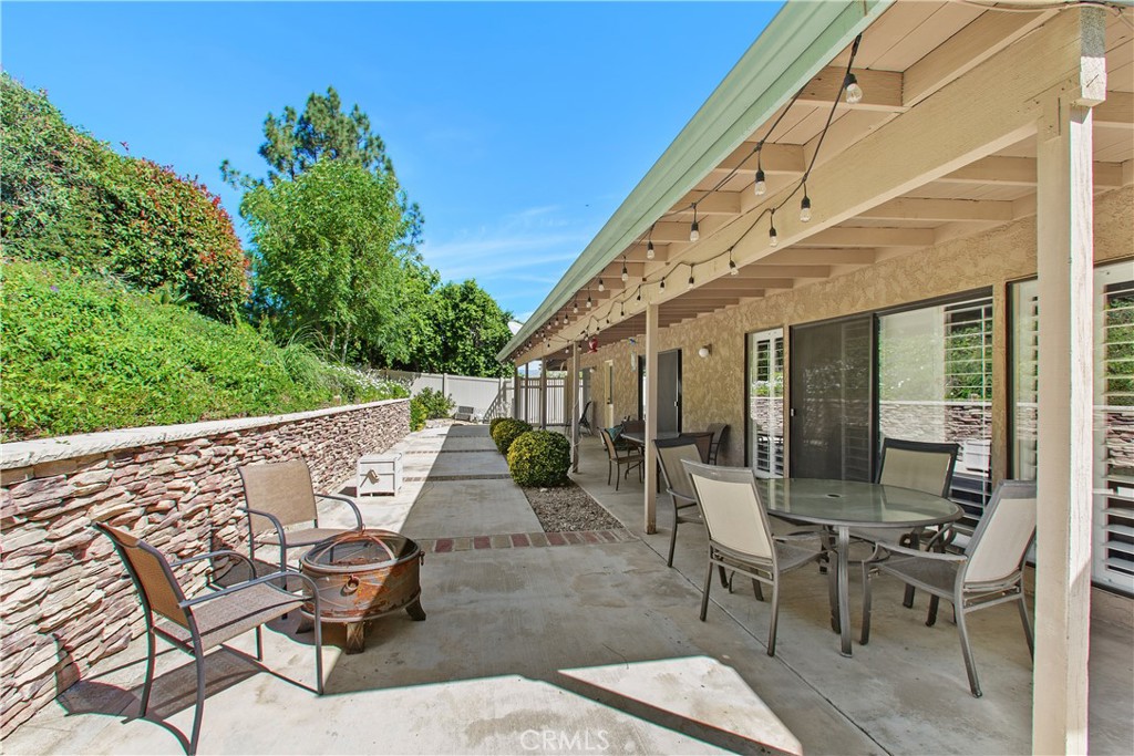1451 Trenton Drive Riverside, CA 92506 - Photo 35 of 41 With access points from the family room, living room, dining room, and the primary bedroom suite, this space provides a true link between the indoor and outdoor living spaces.