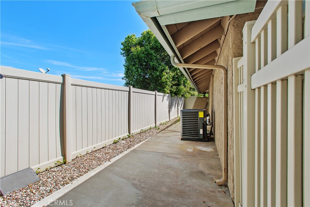 1451 Trenton Drive Riverside, CA 92506 - Photo 39 of 41 This is the other side yard. This side is fenced off from the yard and can be used as a dog run. Also, notice the new condenser for the HVAC system that was just installed in August of 2025. - including new ducting.