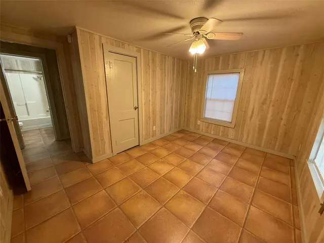 a view of a house with a yard and garage