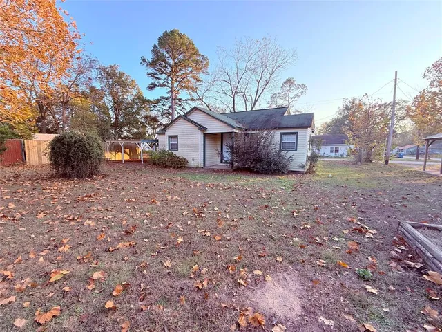 a kitchen with a refrigerator and a stove top oven