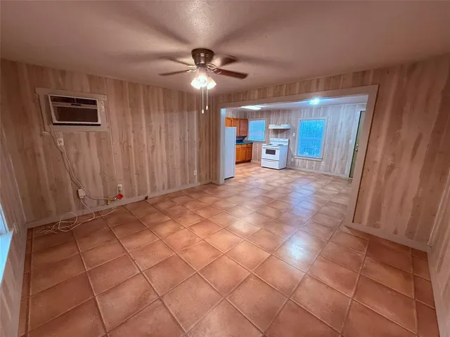 a view of a storage & utility room with a window
