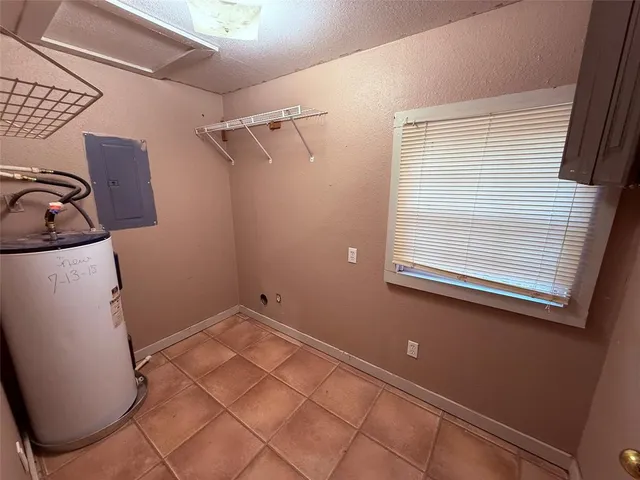 a view of a livingroom with a ceiling fan and window