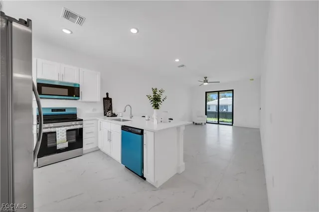 a view of a kitchen with a sink