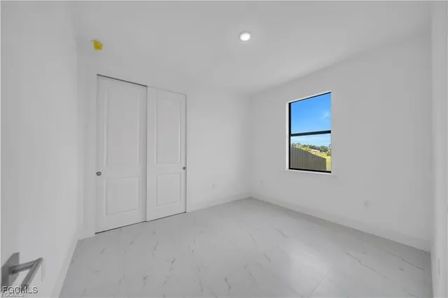 a bathroom with a shower toilet and sink