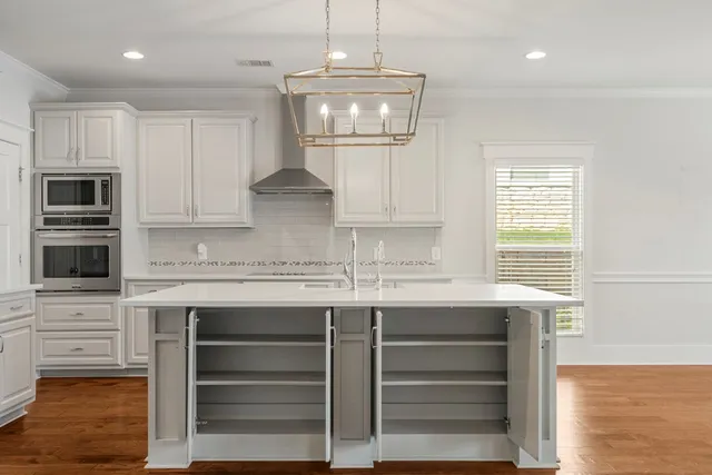 a kitchen with a sink and cabinets