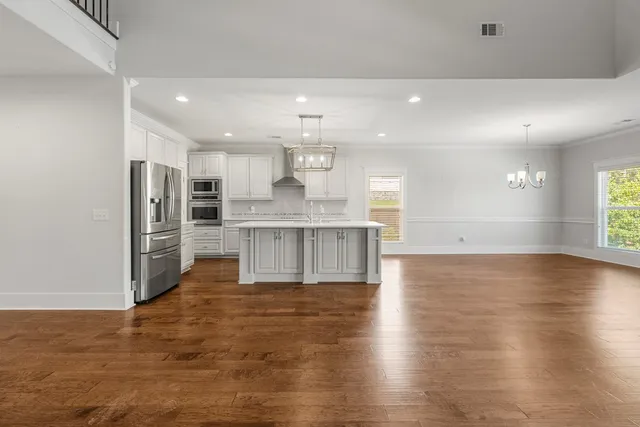 a view of kitchen with wooden floor
