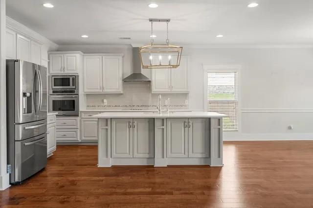 a view of a kitchen with electric appliances