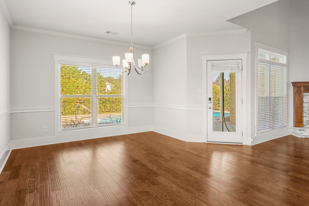 7044 Spring Walk Drive Columbus, GA 31904 - Photo 9 of 41 an empty room with wooden floor and windows