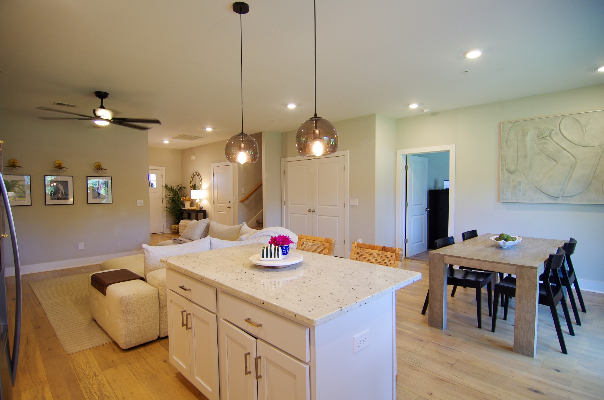 1144 Lock 4 Road, Unit H1 Gallatin, TN 37066 - Photo 14 of 24 a kitchen with a table chairs refrigerator and microwave