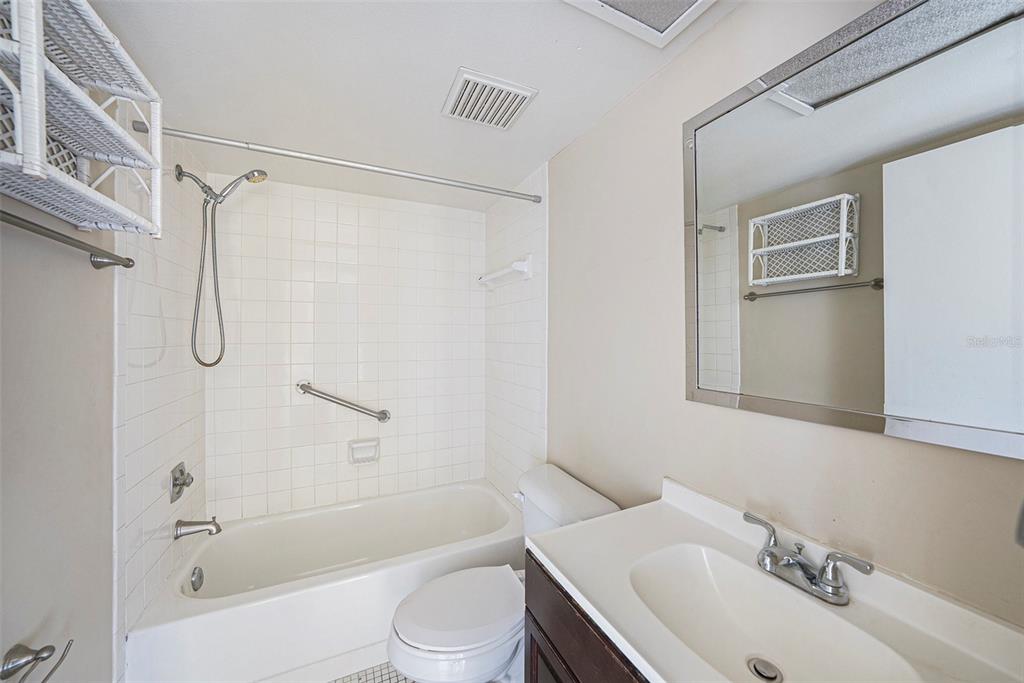 141 Lakeview Way, Unit 141 Oldsmar, FL 34677 - Photo 16 of 28 a bathroom with a sink toilet and shower