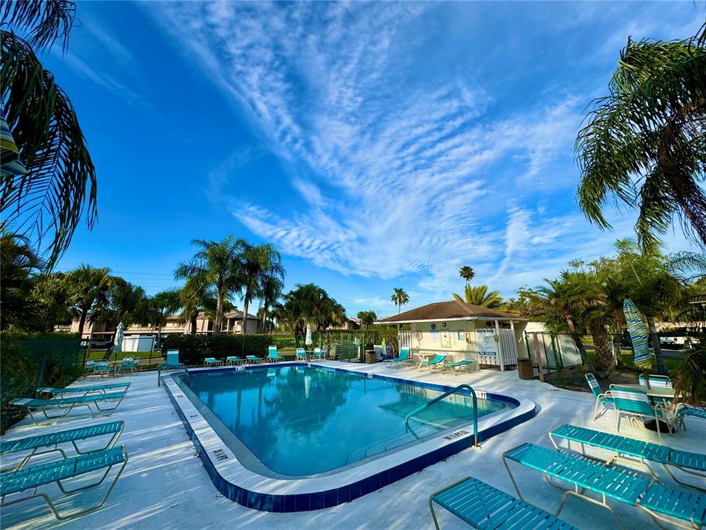 141 Lakeview Way, Unit 141 Oldsmar, FL 34677 - Photo 2 of 28 a view of outdoor space and swimming pool