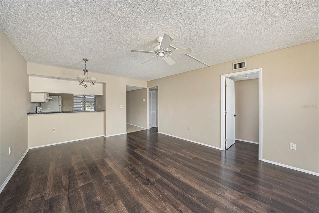 141 Lakeview Way, Unit 141 Oldsmar, FL 34677 - Photo 25 of 28 a view of an empty room with window and wooden floor