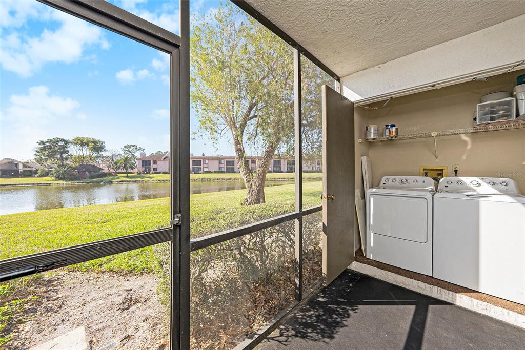 141 Lakeview Way, Unit 141 Oldsmar, FL 34677 - Photo 26 of 28 a view of a room with wooden floor and city view